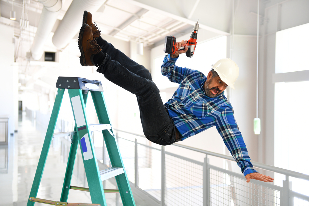 worker slipping and falling off a ladder