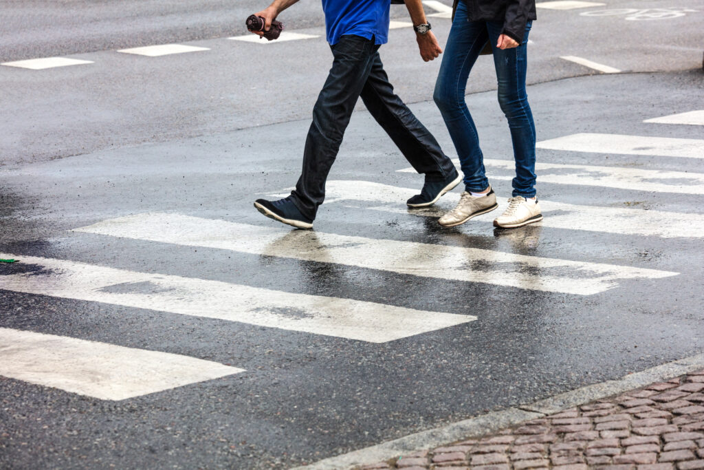 couple walking on a pedestrian crossing